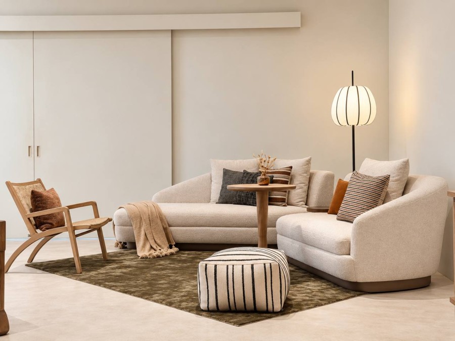 Black and cream striped pouf in a modern living room matched with Burve sofa